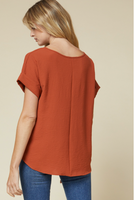 Scoop-neck top featuring rolled sleeve